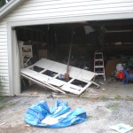 Car drives through garage door.
